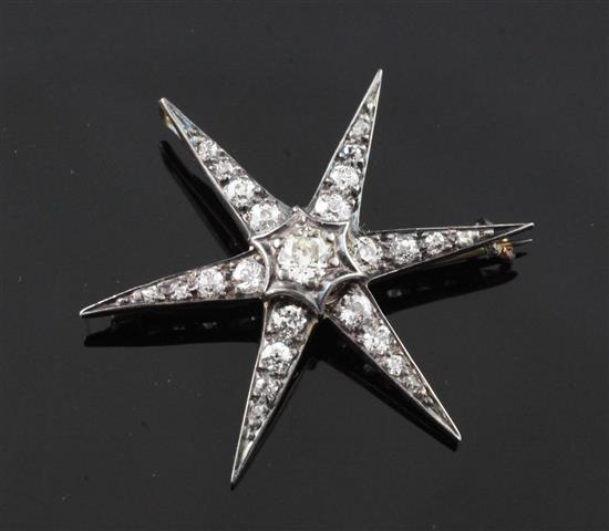 A Victorian gold, silver and graduated diamond star pendant brooch, 1.25in.